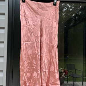 Silly pink skirt, flower details, longer and finished - not shown in the photo